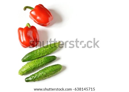 Red sweet peppers and cucumbers. Fresh vegetables. The concept of a healthy eating. Flat lay food photography