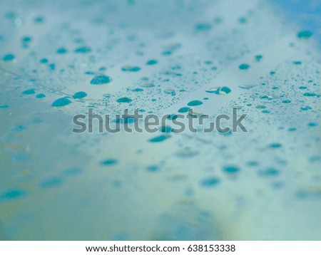 close up of  a water drops on blue background