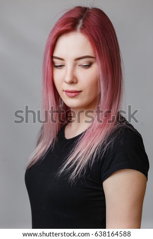 Beautiful girl with pink hair in studio