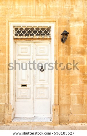 White entrance door to the house in the Island of Malta.