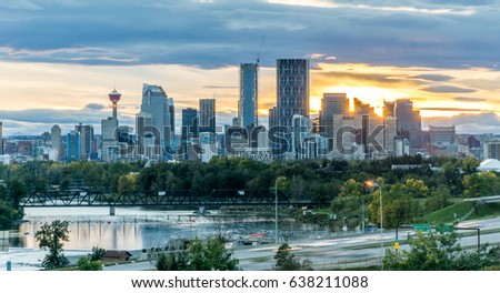 Calgary downtown in the evening at sunset with Bow River  Royalty-Free Stock Photo #638211088