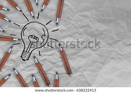 light bulb drawing with wooden pencil with Crumpled fold white paper sheet background