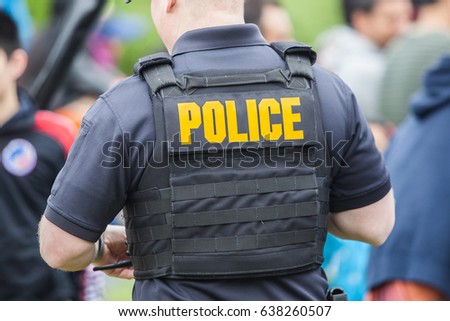 Police uniform on the back of policeman