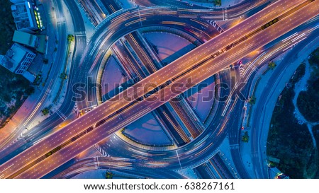Aerial view roundabout interchange of a city, Expressway is an important infrastructure. Royalty-Free Stock Photo #638267161