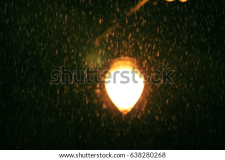 Lamps picture blurred.Shining in the rain in the rainy season.