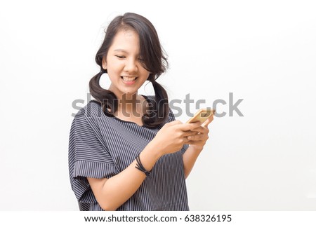 Portrait of a young woman holding a smartphone