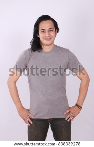 Photo image of an Asian Model smiling and showing blank grey T-Shirt, front view, shirt template