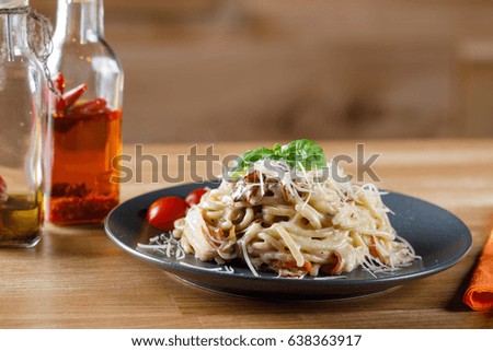 Delicious pasta with bacon and mushrooms. Stock image