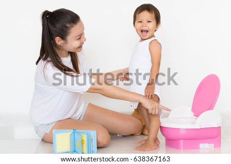 ASIAN GIRL SITTING ON TOILET Stock Photos and Images - Avopix.com