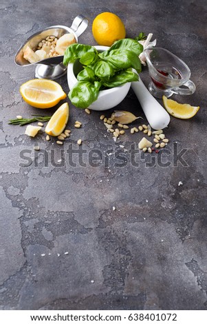 closeup of freshly made pesto with copy space on dark stone background
