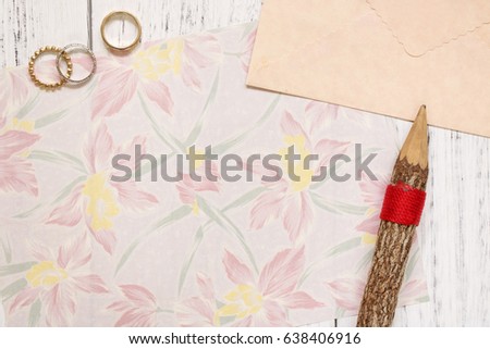 Flat lay stock photography flower pattern letter envelope rings wood pencil