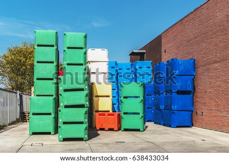 group of collorful fish boxes, plastic fish containers, colorfull fish boxes at the harbor of Urk Netherlands