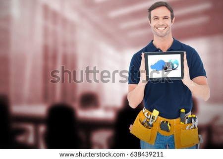 Happy carpenter holding digital tablet against computer generated image of empty board room