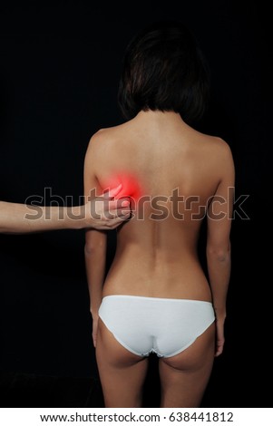 Health Issues. Closeup Of Beautiful Young Woman Having Backache, Strong Back Pain. Female Suffering From Painful Feeling In Muscles, Holding Hands On Her Body. Health Care Concept. High Resolution