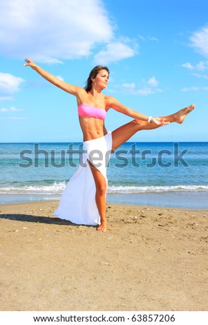 tropical beach: perfect girl meditating on a tropical beach. Copy space