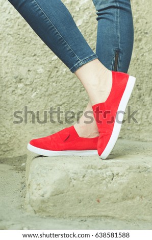 woman in a red sports shoes