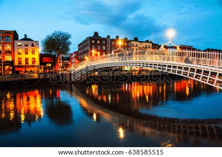 Dublin, Ireland. Night view of famous illuminated Ha Penny Bridge in Dublin, Ireland Royalty-Free Stock Photo #638585515