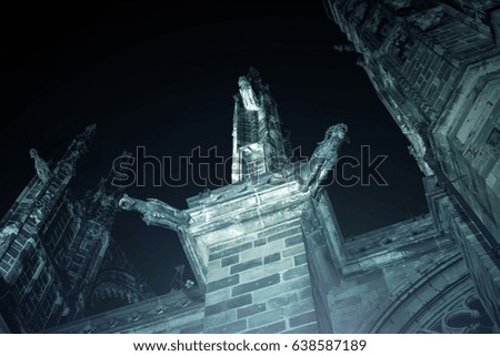 Fragment of beautiful building in the gothic style at night