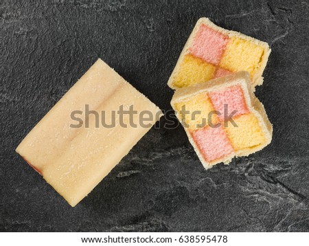 Almond Flavoured Battenberg Sponge Cake on a Black Slate Tile