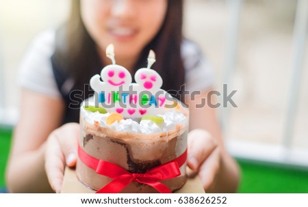 girl and happy birthday chocolate cake.
