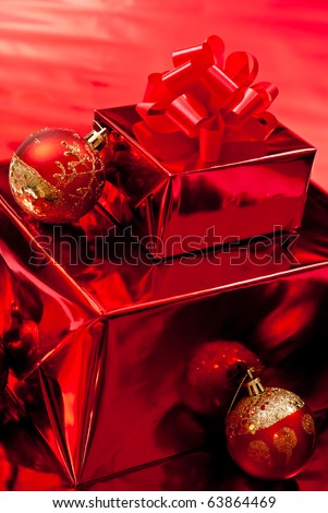 Red christmas gifts and toys on red background
