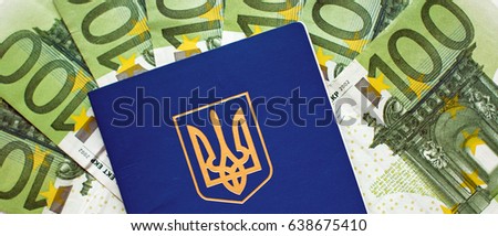 Ukrainian passport for travel abroad on a background of euro banknotes (visa regime for Ukrainian, green light for Ukraine, open Europe - concept)