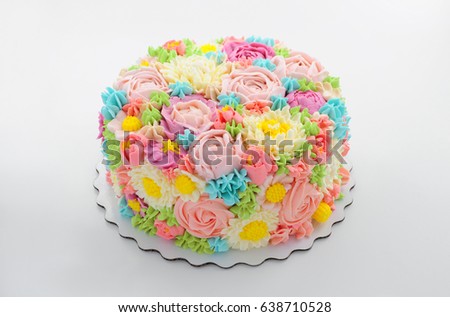Cake with color cream flowers on white background. Picture for a menu or a confectionery catalog.