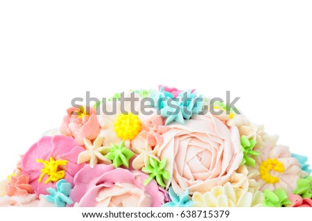 Cake with color cream flowers on white background. Top view. Picture for a menu or a confectionery catalog.