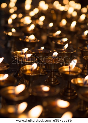 Burning candles in a Temple. Hindu temple in Muktinath, Nepal.