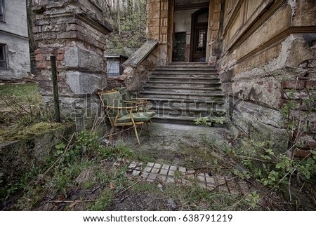 Abandoned chairs by the stairs