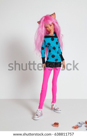 doll with pink hair