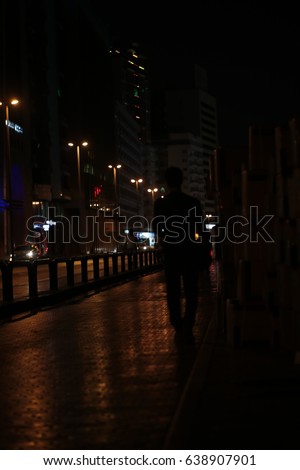 dubai street photography, people walk and traffic blur images good for background.