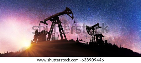 Ukraine, Carpathians night photo of the European oil rig rocking the pump on the background of the Milky Way Galaxy in the universe. Symbol of energy and ecology of planet Earth