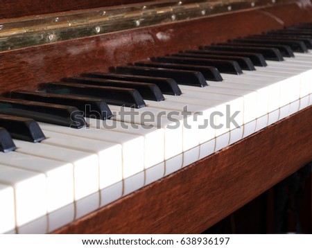 Old piano keys on a dark background        