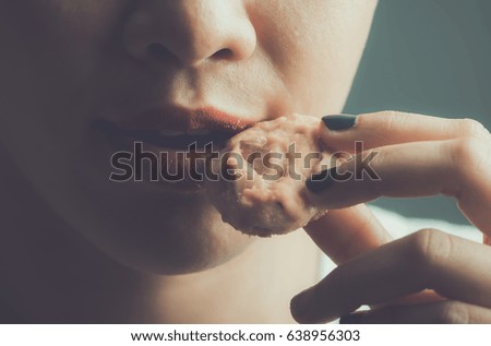 young woman eating a cookie, vintage color pictures