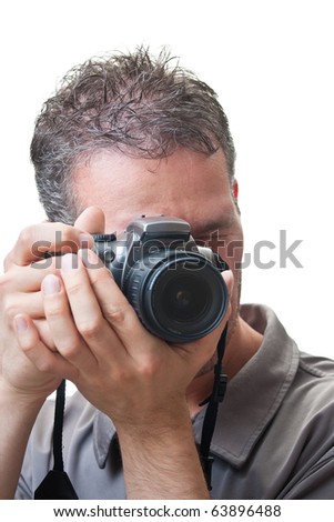 A closeup on the face of a man with a digital slr camera up to his eye, in the process of taking a picture, isolated on white.