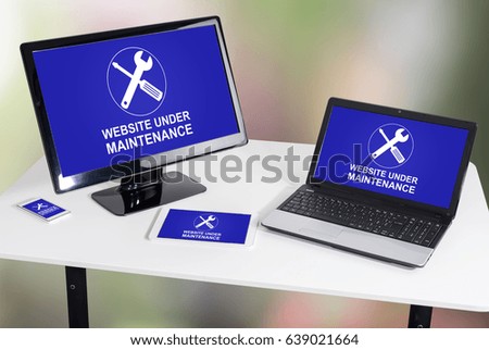 Website maintenance concept shown on different information technology devices