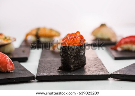 Close-up of Ikura Gunkan Sushi with caviar isolated on white background