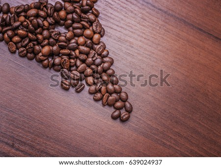 Beautiful coffee beans, Fried coffee beans on a chocolate board.