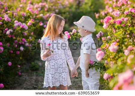 Cheerful children in flowers