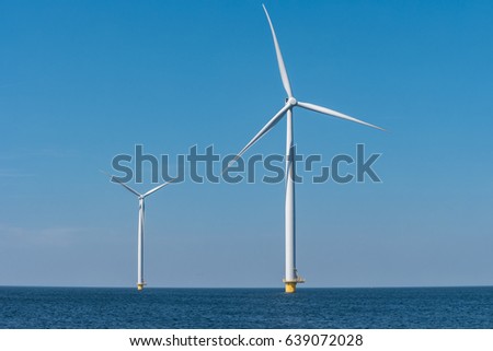 Windmill park Westermeerwind the largest wind farm offshore and on land in theNetherlands.The wind farm produce 1.4 TWh of electricity, enough electricity to over 400,000 households.Urk,Netherlands Royalty-Free Stock Photo #639072028