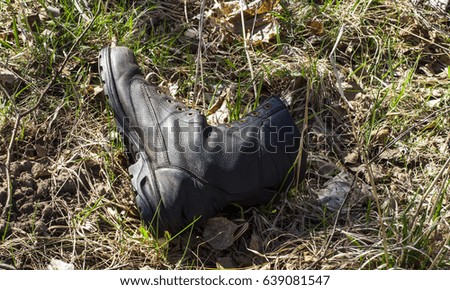 Army boot in the grass