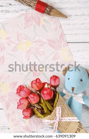 Flat lay stock photography flower pattern message letter paper blue bear holding rose wood pencil