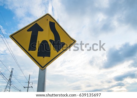 Traffic sign, The way forward is a shared way with no islands or anything else dividing the traffic. Drive slower and to the left of the way. And be more careful. sky background.