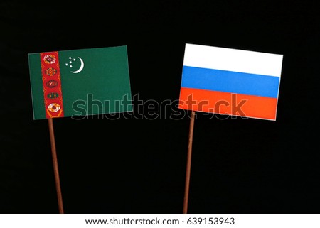 Turkmenistan flag with Russian flag isolated on black background