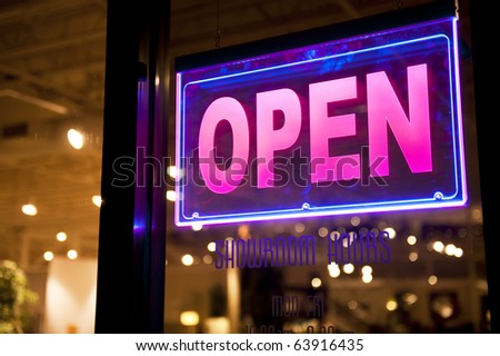 lighted open sign at a showroom