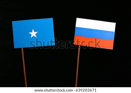 Somalian flag with Russian flag isolated on black background