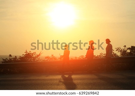 Sunset and Silhouette picture of group running