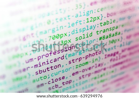 Displaying program code on computer. Script procedure creating. Software engineer at work. Database bits access stream visualisation. Website HTML Code on the Laptop Display Closeup Photo. 
