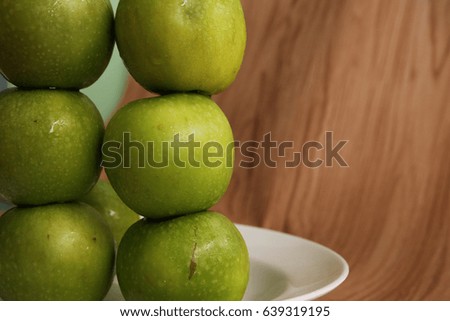 perfect green apple on wood tablee